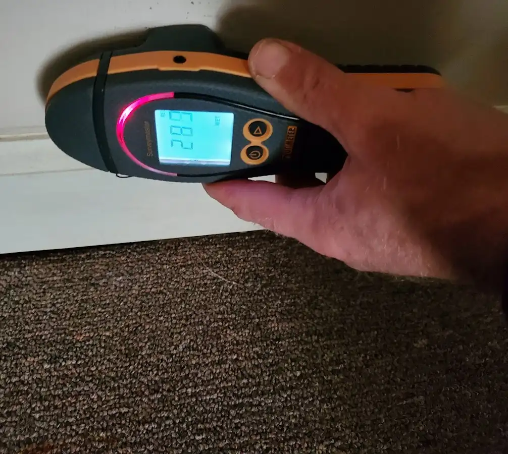 Moisture detection at baseboard during Burst Pipe Cleanup in Gallup